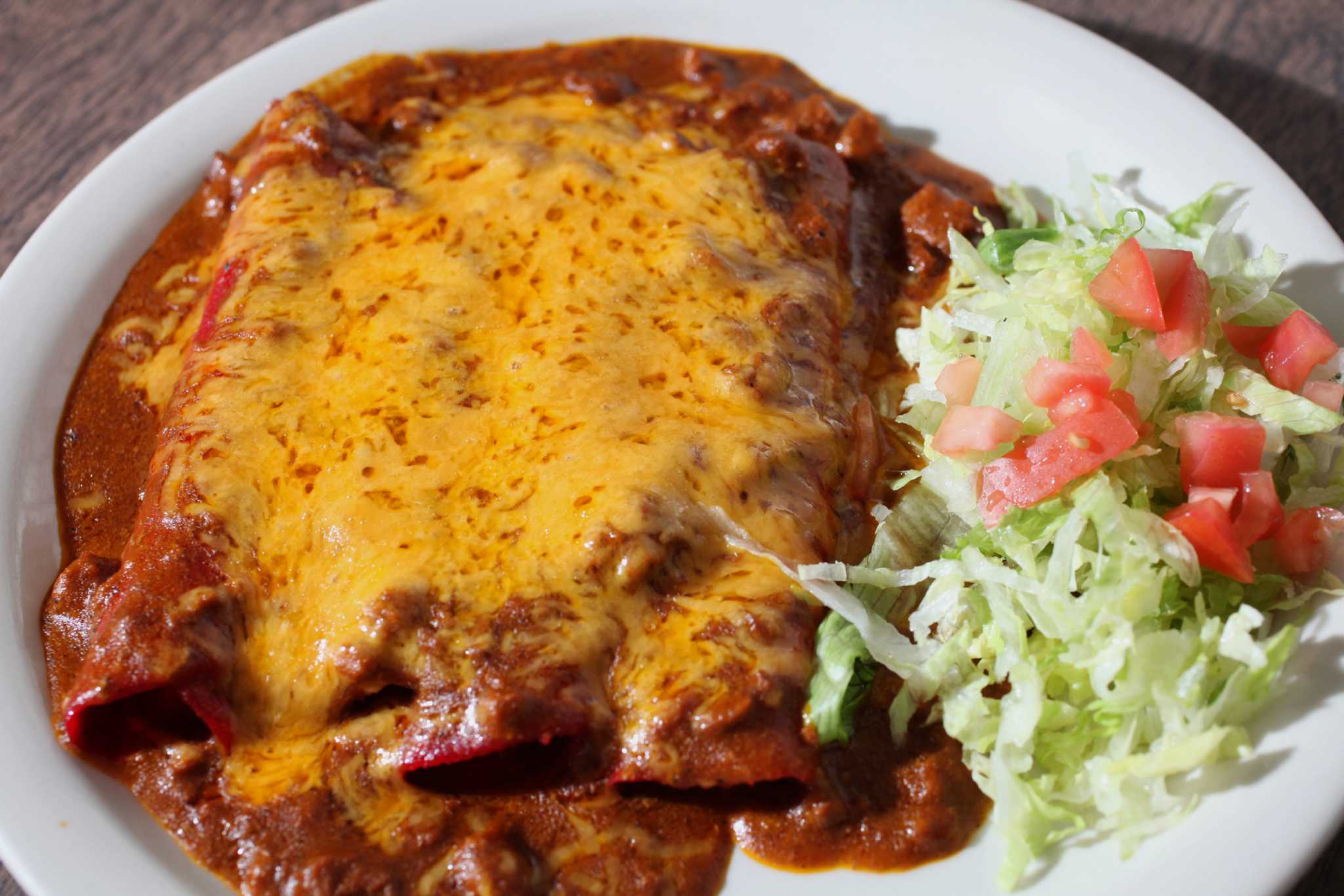 Garcia's Mexican Food signature dishes Cheese Enchilada PlateCountry Sausage TacoBrisket Plate with Rice Refried Beans Salad & Guacamole